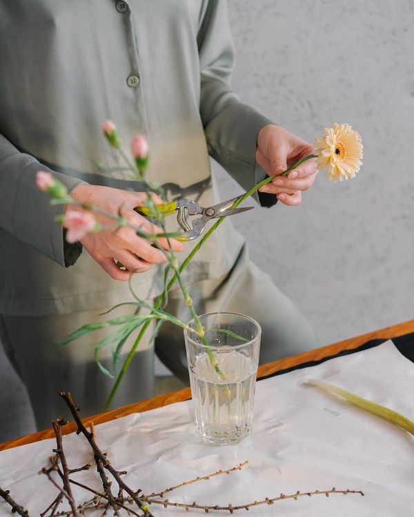 Woman practicing controlled breathing in a calm, modern space.